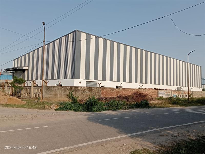 Road-side elevation of a long pre-engineered warehouse